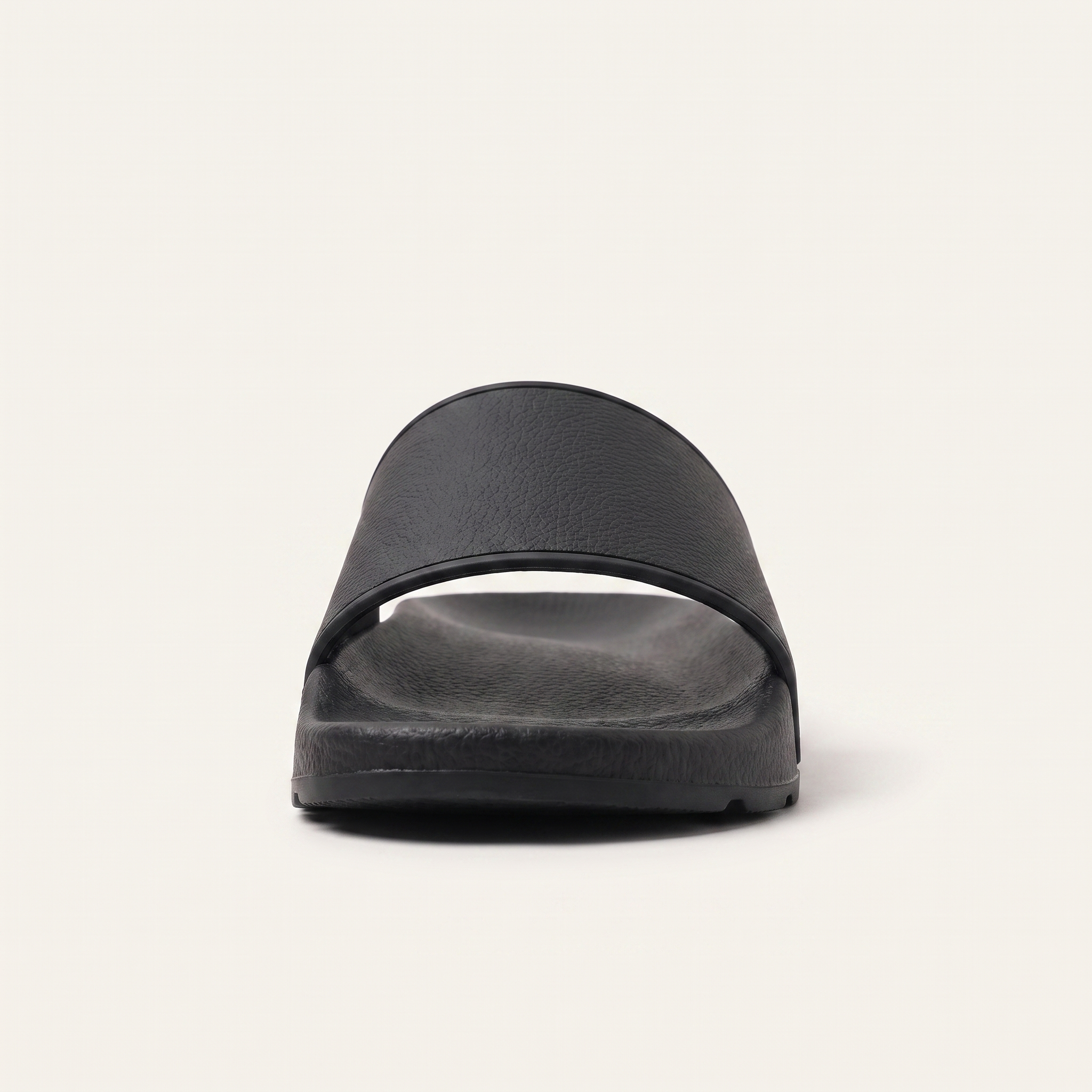 Black slide sandal, front on